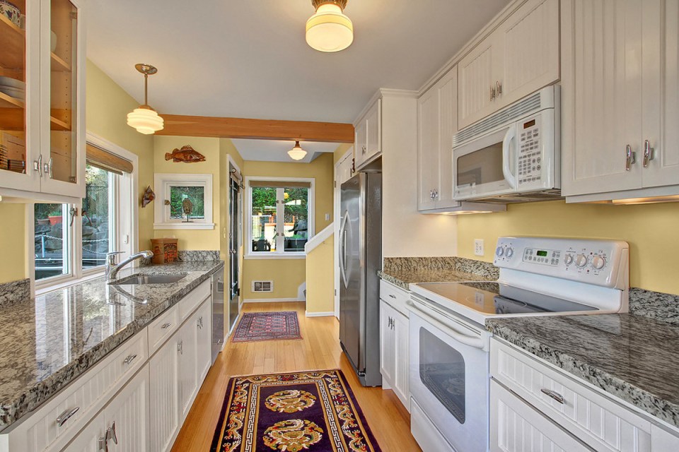 A Craftsman-style float house in Seattle's Portage Bay with two bedrooms in 960 sq ft. | www.facebook.com/SmallHouseBliss