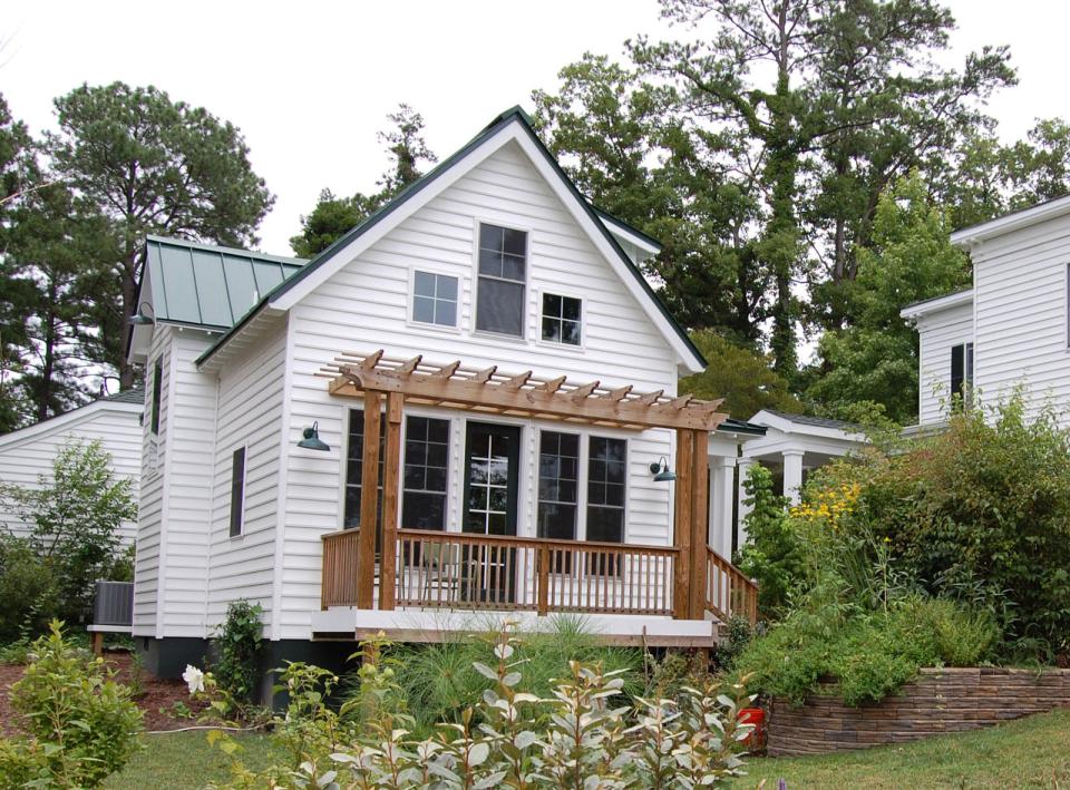 This traditional "Katrina Cottage" design has 3 bedrooms in 1,112 sq ft. | www.facebook.com/SmallHouseBliss
