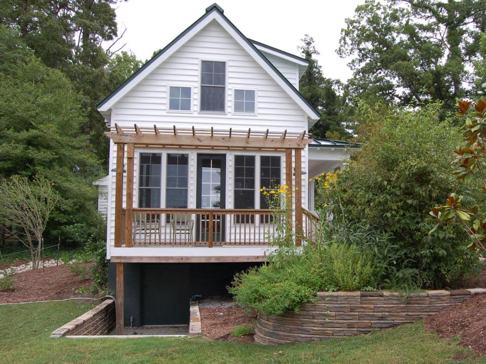 This traditional "Katrina Cottage" design has 3 bedrooms in 1,112 sq ft. | www.facebook.com/SmallHouseBliss