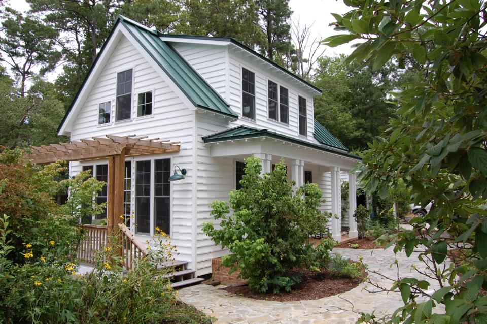 This traditional "Katrina Cottage" design has 3 bedrooms in 1,112 sq ft. | www.facebook.com/SmallHouseBliss