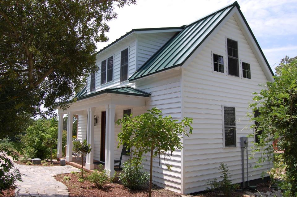 This traditional "Katrina Cottage" design has 3 bedrooms in 1,112 sq ft. | www.facebook.com/SmallHouseBliss
