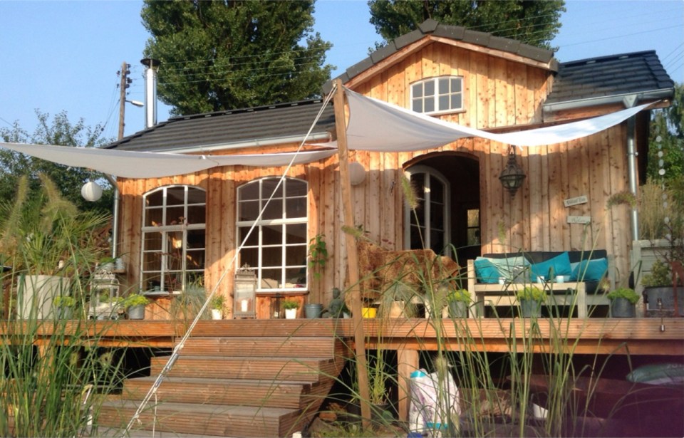 This small garden cottage located in an allotment garden has a kitchenette, half bath and sleeping loft in 258 sq ft. | www.facebook.com/SmallHouseBliss