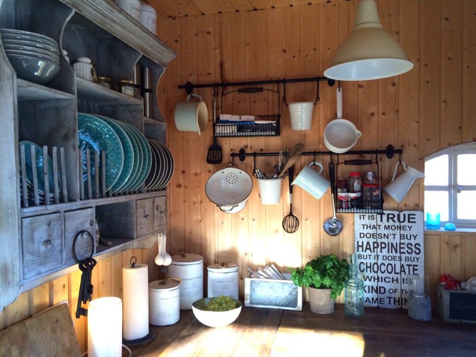 This small garden cottage located in an allotment garden has a kitchenette, half bath and sleeping loft in 258 sq ft. | www.facebook.com/SmallHouseBliss