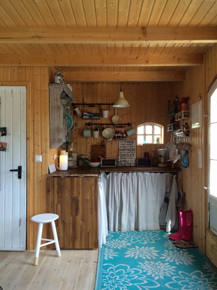 This small garden cottage located in an allotment garden has a kitchenette, half bath and sleeping loft in 258 sq ft. | www.facebook.com/SmallHouseBliss