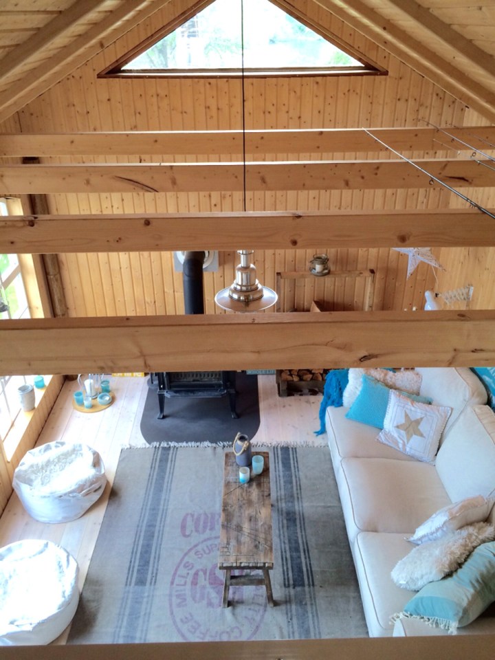 This small garden cottage located in an allotment garden has a kitchenette, half bath and sleeping loft in 258 sq ft. | www.facebook.com/SmallHouseBliss