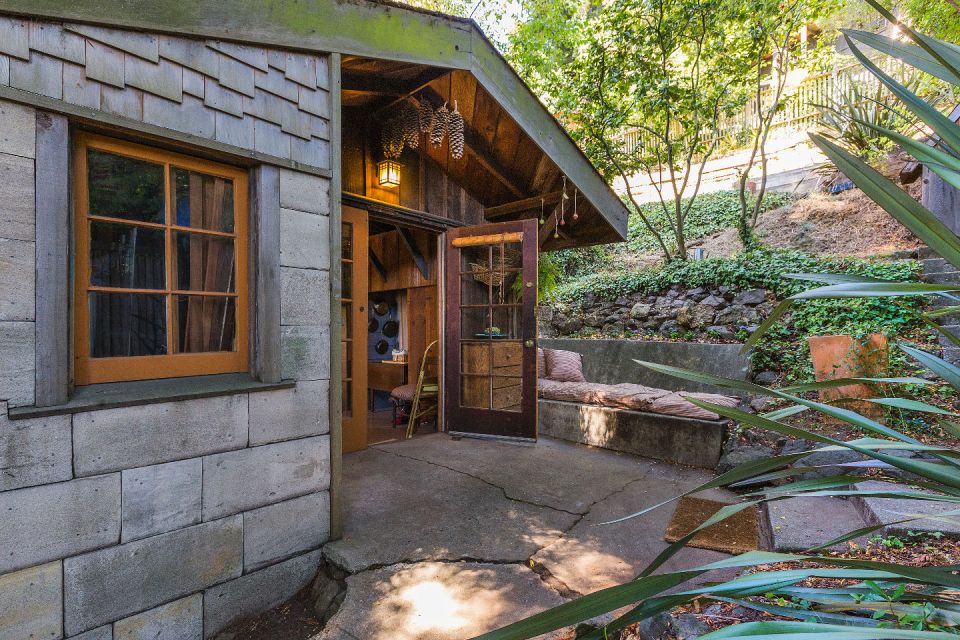 The "Cubby", designed by architect Bernard Maybeck, started out as a garage and was later expanded into an eclectic 724 sq ft cottage with one bedroom. | www.facebook.com/SmallHouseBliss