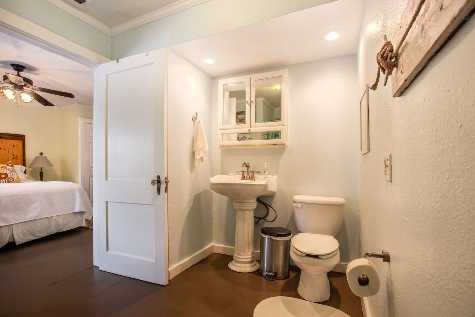 A ramshackle exterior conceals a modern one-bedroom home in this dock house perched over a river within sight of downtown Tampa, Florida. | www.facebook.com/SmallHouseBliss