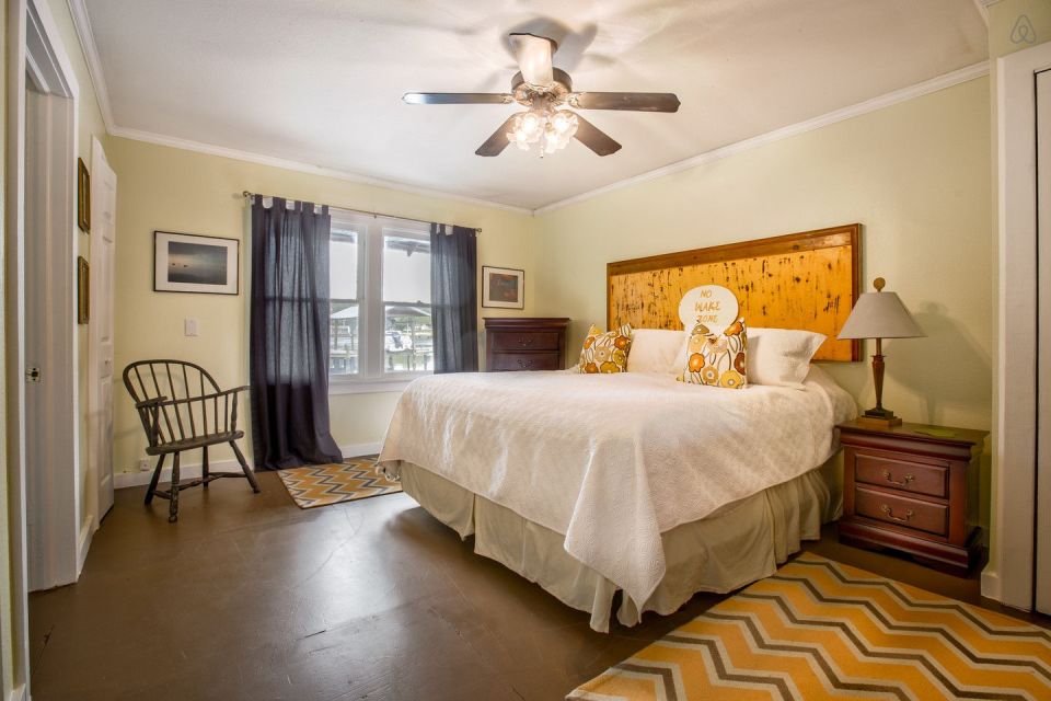 A ramshackle exterior conceals a modern one-bedroom home in this dock house perched over a river within sight of downtown Tampa, Florida. | www.facebook.com/SmallHouseBliss