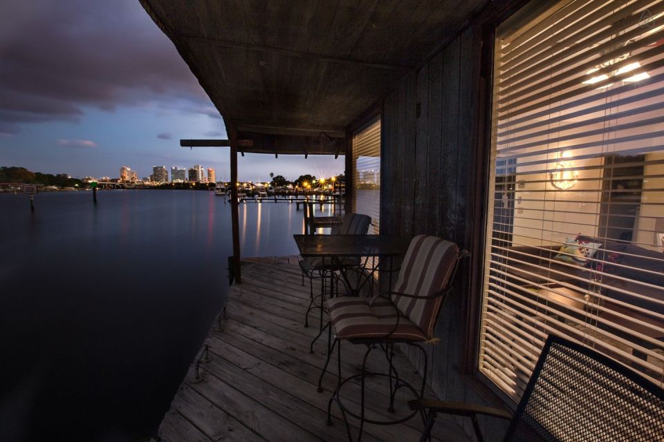 A ramshackle exterior conceals a modern one-bedroom home in this dock house perched over a river within sight of downtown Tampa, Florida. | www.facebook.com/SmallHouseBliss