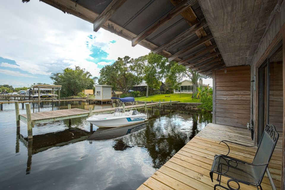 A ramshackle exterior conceals a modern one-bedroom home in this dock house perched over a river within sight of downtown Tampa, Florida. | www.facebook.com/SmallHouseBliss