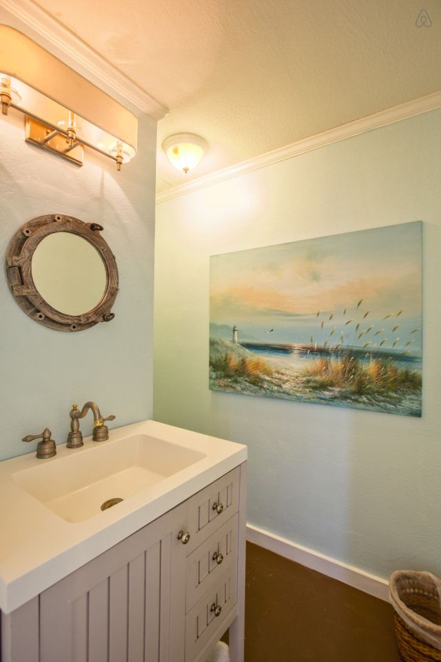 A ramshackle exterior conceals a modern one-bedroom home in this dock house perched over a river within sight of downtown Tampa, Florida. | www.facebook.com/SmallHouseBliss