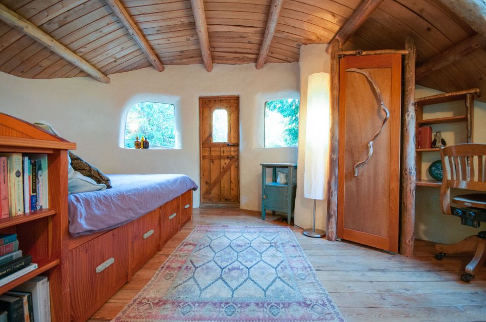 A one-bedroom storybook cottage with curved walls sculpted from cob, a mixture of clay, sand and straw. | www.facebook.com/SmallHouseBliss