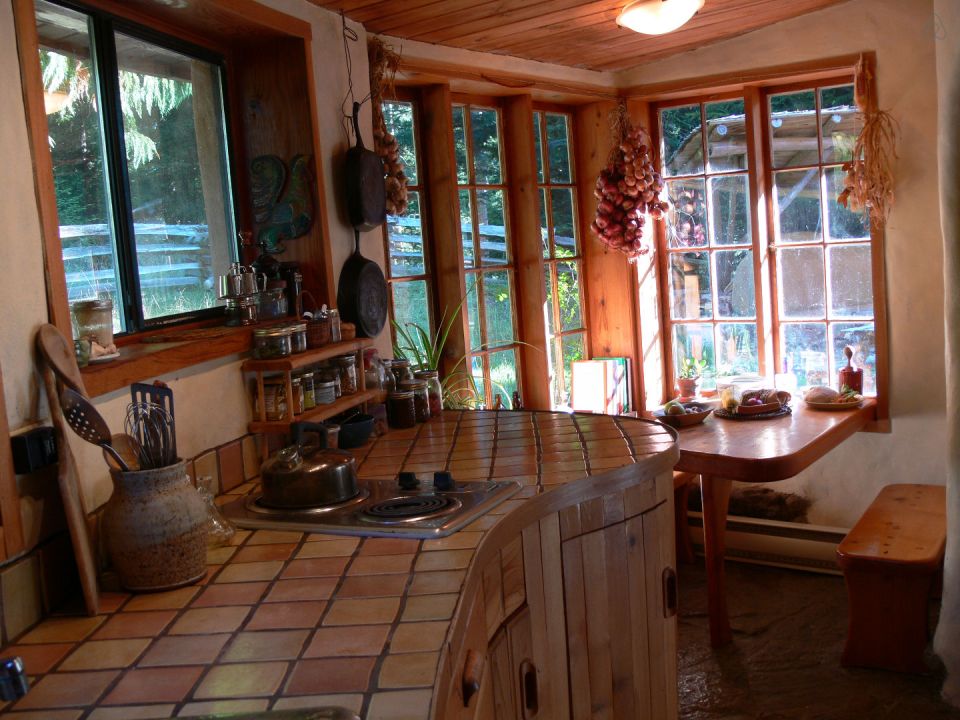 A one-bedroom storybook cottage with curved walls sculpted from cob, a mixture of clay, sand and straw. | www.facebook.com/SmallHouseBliss