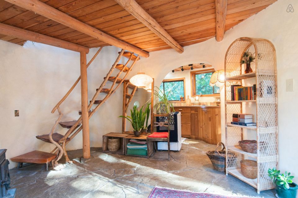 A one-bedroom storybook cottage with curved walls sculpted from cob, a mixture of clay, sand and straw. | www.facebook.com/SmallHouseBliss