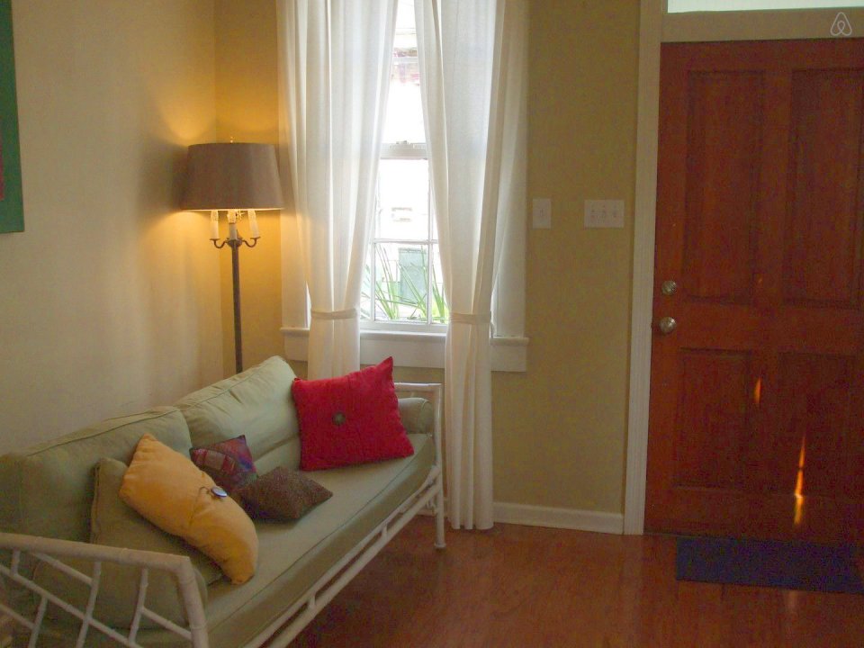 A tiny "shotgun" cottage in the Irish Channel neighborhood of New Orleans. It has one bedroom in roughly 400 sq ft. | www.facebook.com/SmallHouseBliss