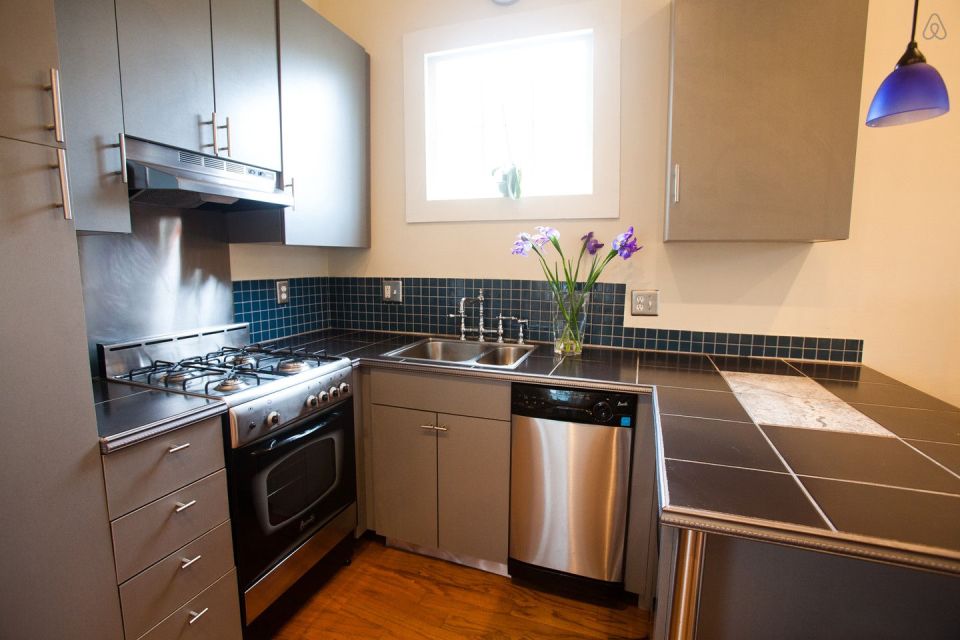 A tiny "shotgun" cottage in the Irish Channel neighborhood of New Orleans. It has one bedroom in roughly 400 sq ft. | www.facebook.com/SmallHouseBliss