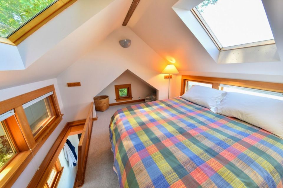 A tiny cottage on Washington's Lummi Island. The 458 sq ft cottage has a distinctive roof lantern to accommodate a loft bedroom. | www.facebook.com/SmallHouseBliss