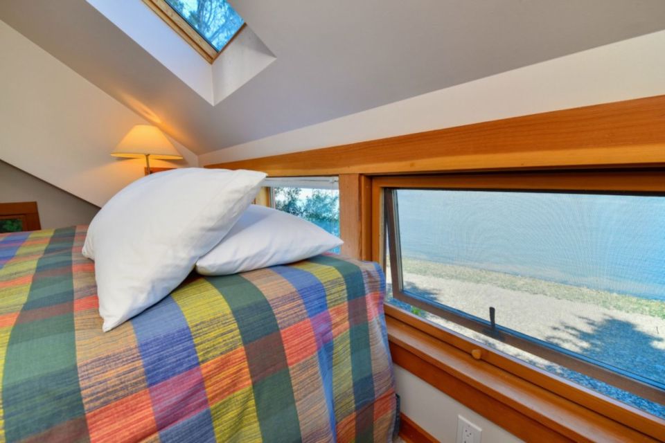A tiny cottage on Washington's Lummi Island. The 458 sq ft cottage has a distinctive roof lantern to accommodate a loft bedroom. | www.facebook.com/SmallHouseBliss