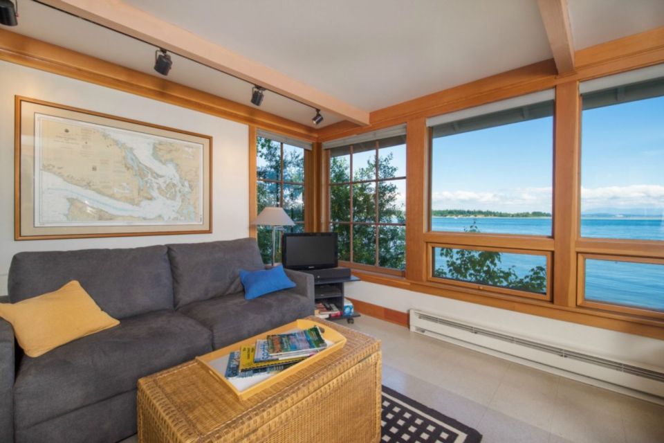 A tiny cottage on Washington's Lummi Island. The 458 sq ft cottage has a distinctive roof lantern to accommodate a loft bedroom. | www.facebook.com/SmallHouseBliss