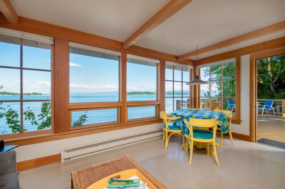 A tiny cottage on Washington's Lummi Island. The 458 sq ft cottage has a distinctive roof lantern to accommodate a loft bedroom. | www.facebook.com/SmallHouseBliss