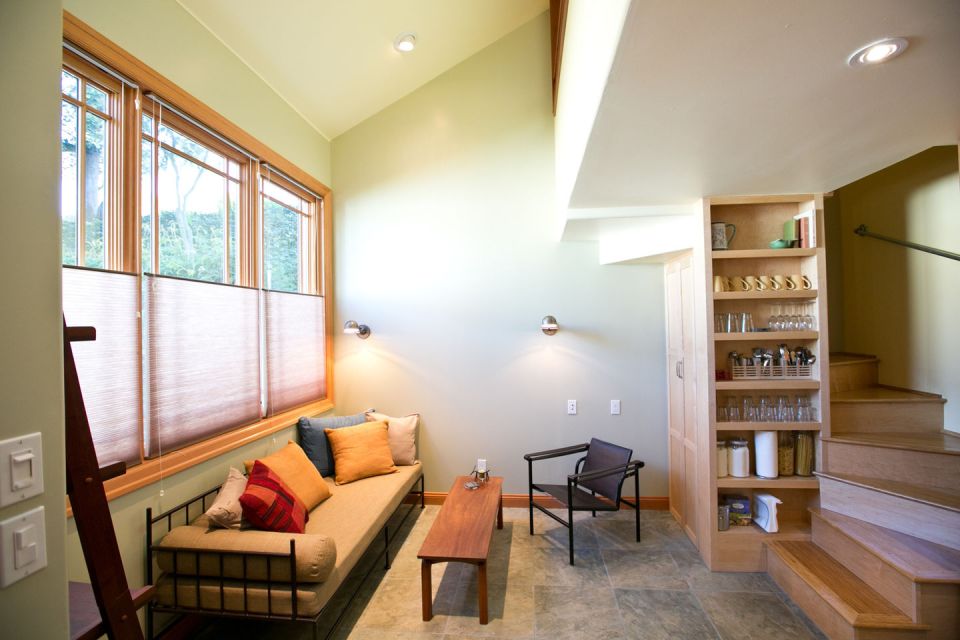 Though just 469 sq ft total, Susan's backyard cottage squeezes in spiral stairs to the loft bedroom. | www.facebook.com/SmallHouseBliss