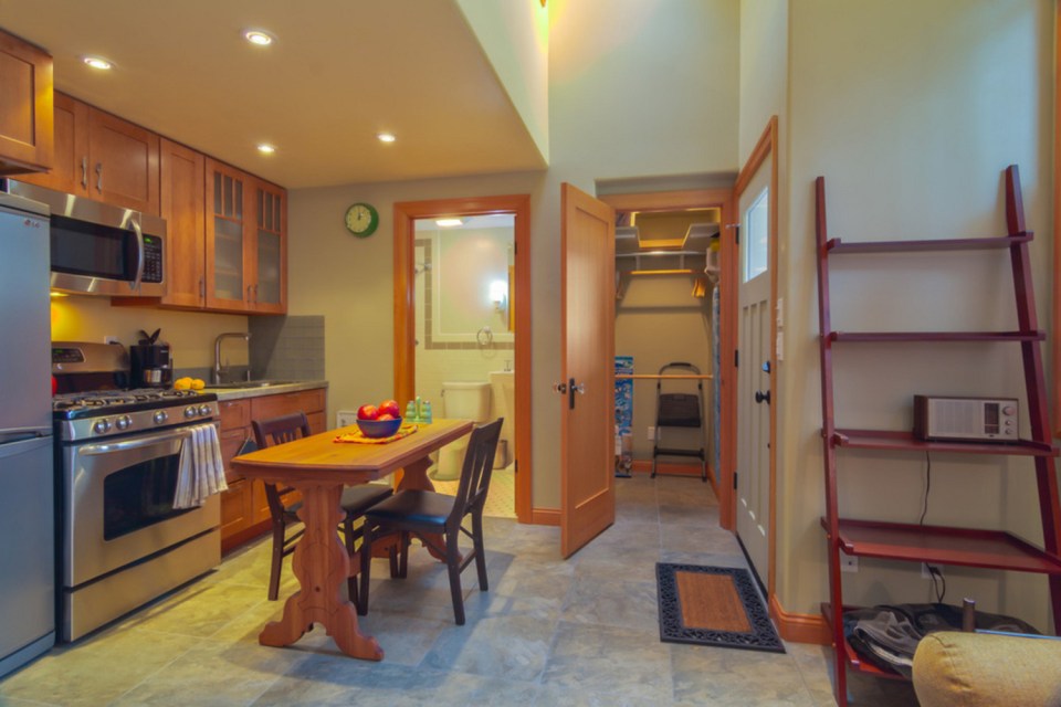 Though just 469 sq ft total, Susan's backyard cottage squeezes in spiral stairs to the loft bedroom. | www.facebook.com/SmallHouseBliss