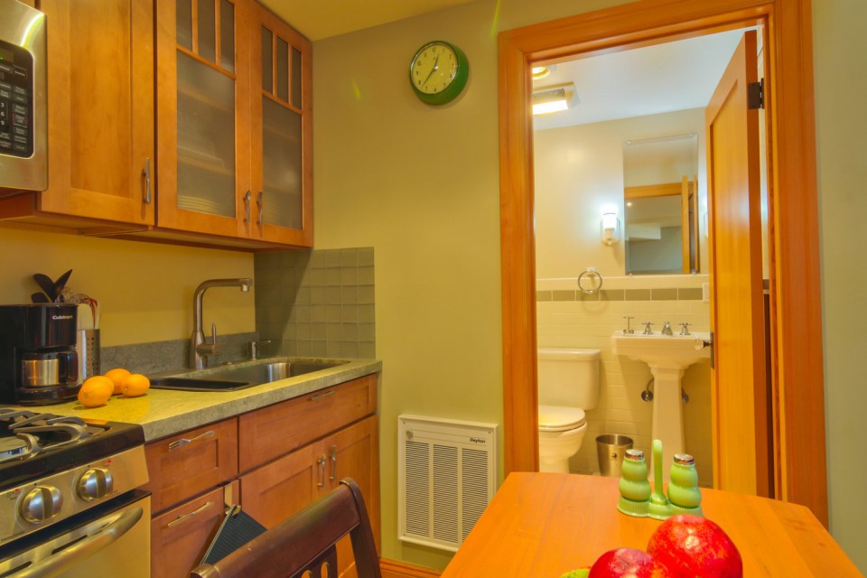 Though just 469 sq ft total, Susan's backyard cottage squeezes in spiral stairs to the loft bedroom. | www.facebook.com/SmallHouseBliss