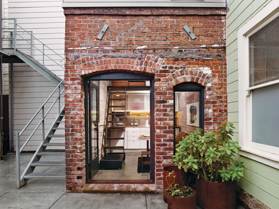 The Brick House, a self-contained guest suite built within a 94 sq ft former laundry boiler room. | www.facebook.com/SmallHouseBliss