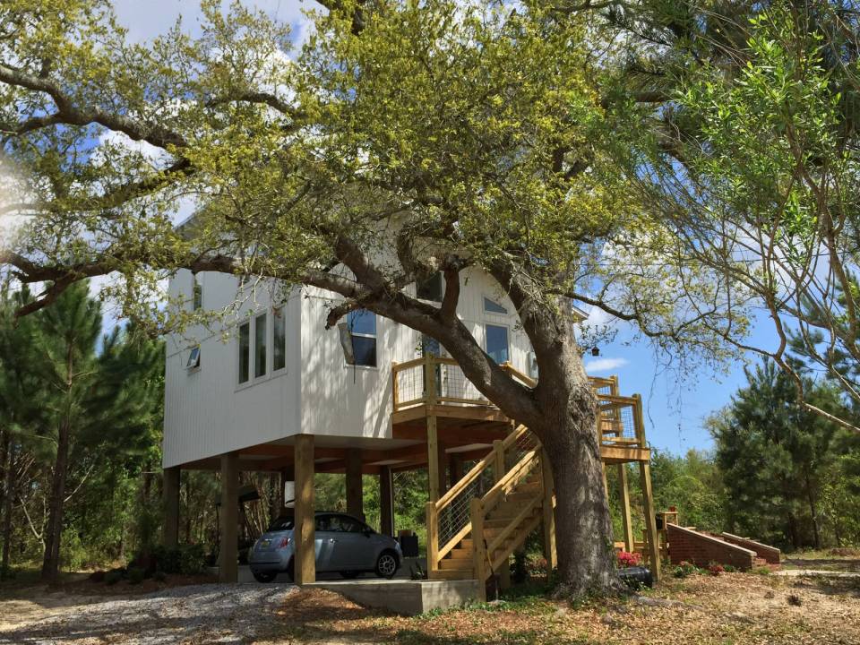 This small beach house, elevated for protection from storm surges, has one bedroom and a loft in a 24’ square footprint. | www.facebook.com/SmallHouseBliss