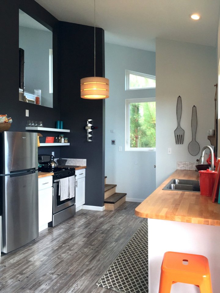 This small beach house, elevated for protection from storm surges, has one bedroom and a loft in a 24’ square footprint. | www.facebook.com/SmallHouseBliss