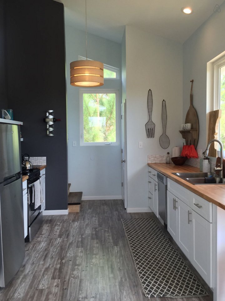 This small beach house, elevated for protection from storm surges, has one bedroom and a loft in a 24’ square footprint. | www.facebook.com/SmallHouseBliss