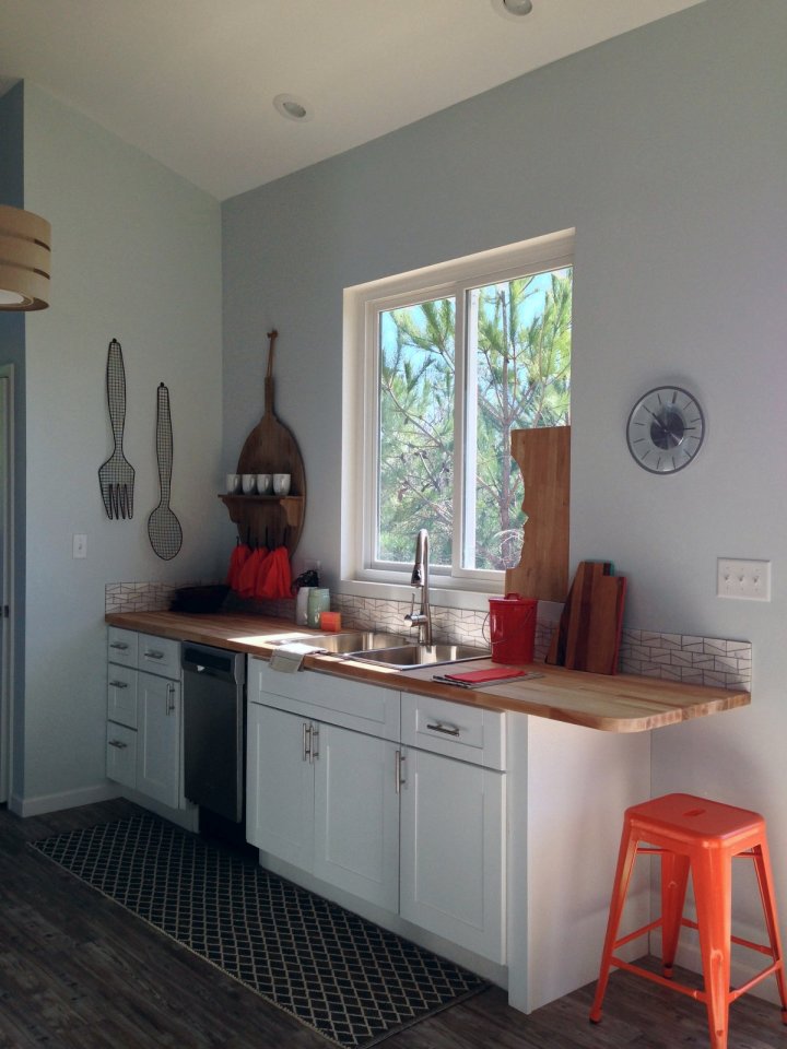 This small beach house, elevated for protection from storm surges, has one bedroom and a loft in a 24’ square footprint. | www.facebook.com/SmallHouseBliss