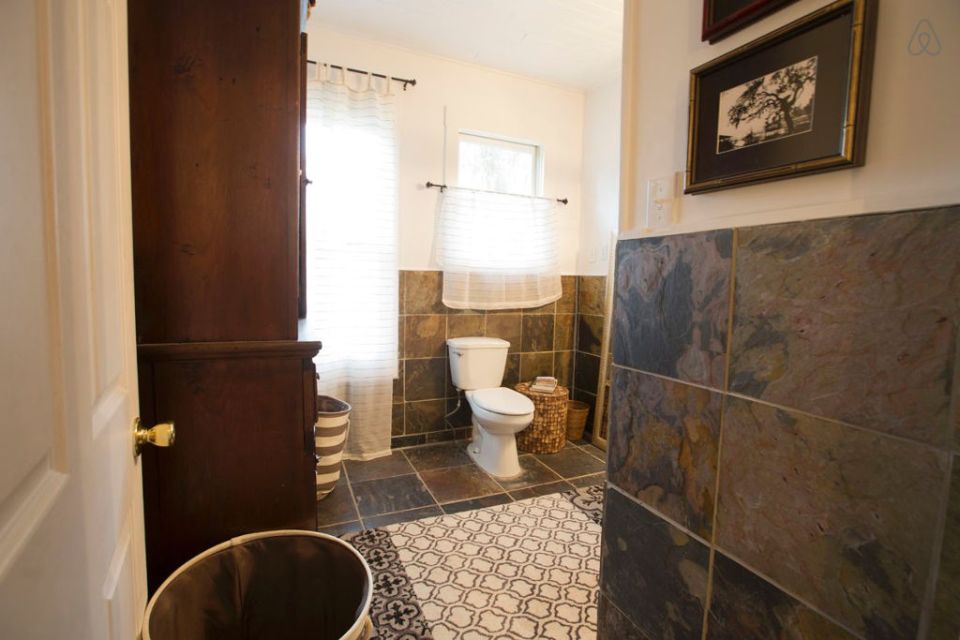 This modest two-bedroom bungalow outside Savannah, Georgia features a spacious wraparound porch. | www.facebook.com/SmallHouseBliss