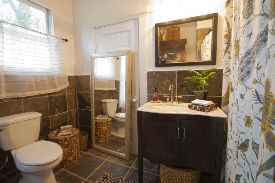 This modest two-bedroom bungalow outside Savannah, Georgia features a spacious wraparound porch. | www.facebook.com/SmallHouseBliss