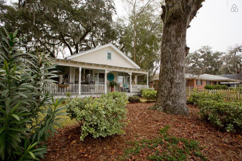This modest two-bedroom bungalow outside Savannah, Georgia features a spacious wraparound porch. | www.facebook.com/SmallHouseBliss