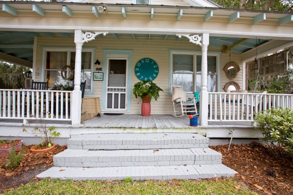 This modest two-bedroom bungalow outside Savannah, Georgia features a spacious wraparound porch. | www.facebook.com/SmallHouseBliss