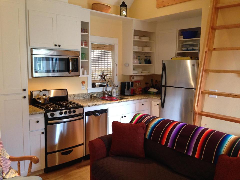 With a ground-floor bedroom, this tiny cottage on the Oregon Coast supports single-level living. It has a 416 sq ft main level plus a sleeping loft. | www.facebook.com/SmallHouseBliss