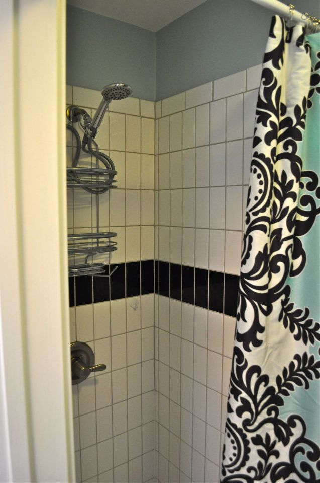 The Birdhouse, a tall and skinny tiny house with the kitchen, living room and bedroom each occupying one of the three floors. | www.facebook.com/SmallHouseBliss