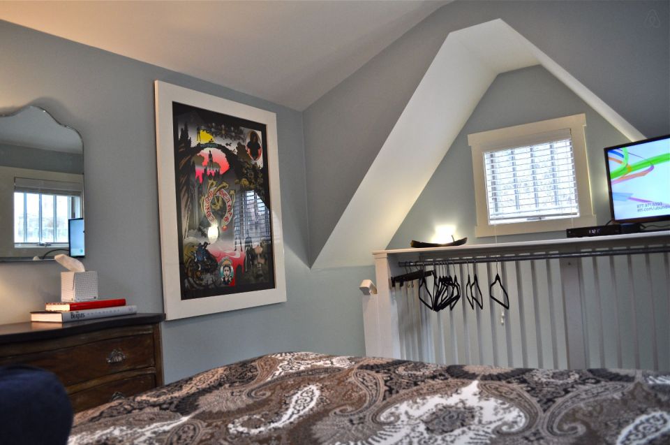 The Birdhouse, a tall and skinny tiny house with the kitchen, living room and bedroom each occupying one of the three floors. | www.facebook.com/SmallHouseBliss