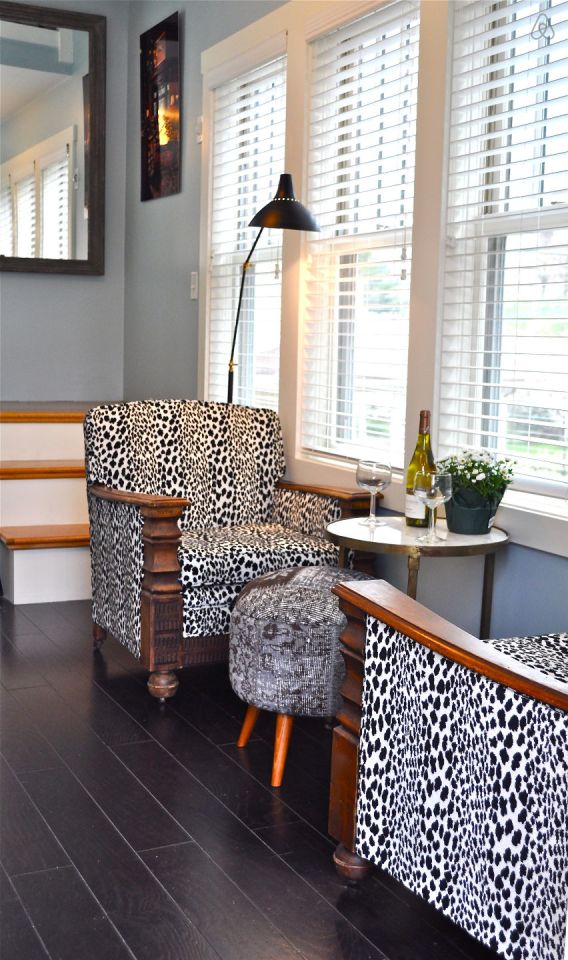 The Birdhouse, a tall and skinny tiny house with the kitchen, living room and bedroom each occupying one of the three floors. | www.facebook.com/SmallHouseBliss