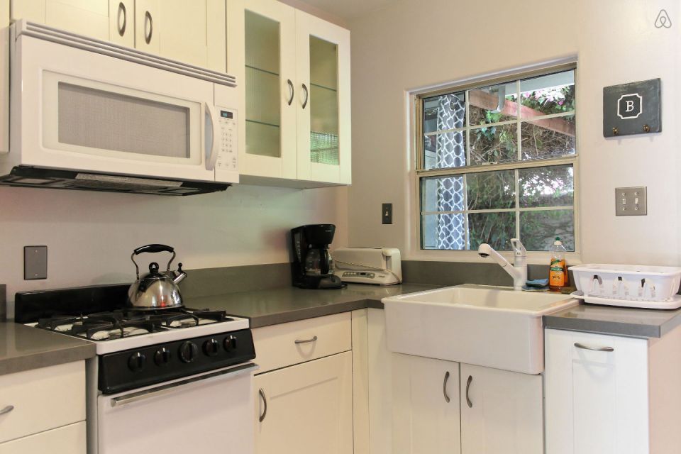 This 1922 cottage is one of six in a California “bungalow court”. It has one bedroom on the 416 sq ft main level plus a sleeping loft. | www.facebook.com/SmallHouseBliss