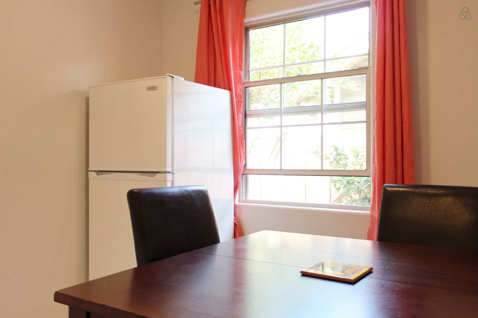 This 1922 cottage is one of six in a California “bungalow court”. It has one bedroom on the 416 sq ft main level plus a sleeping loft. | www.facebook.com/SmallHouseBliss