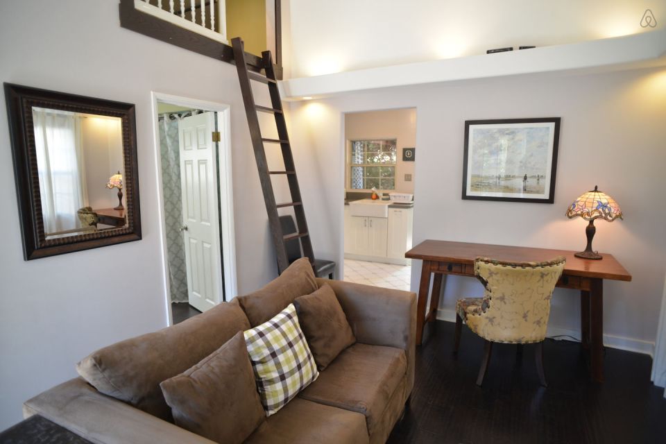 This 1922 cottage is one of six in a California “bungalow court”. It has one bedroom on the 416 sq ft main level plus a sleeping loft. | www.facebook.com/SmallHouseBliss