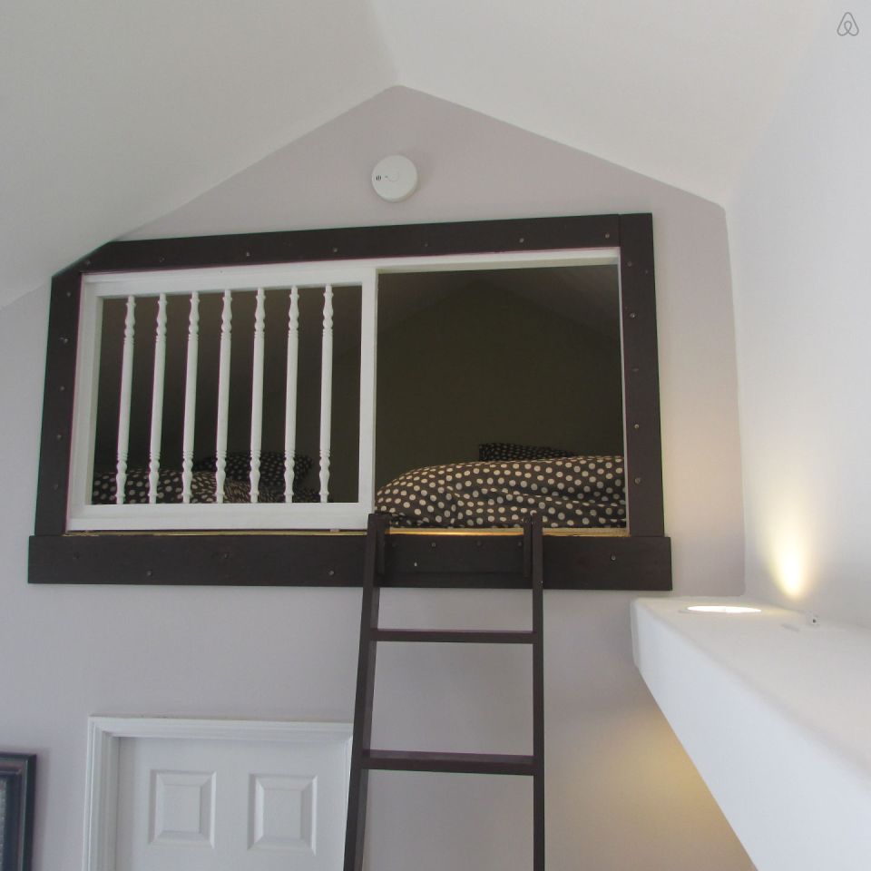 This 1922 cottage is one of six in a California “bungalow court”. It has one bedroom on the 416 sq ft main level plus a sleeping loft. | www.facebook.com/SmallHouseBliss