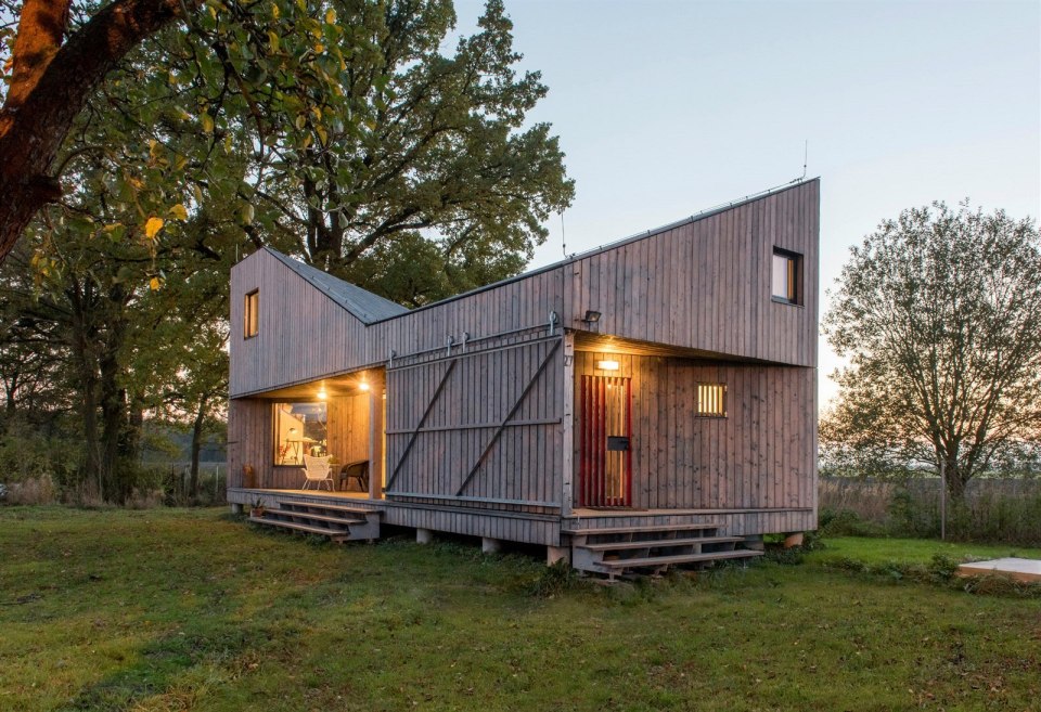 A distinctive folded roof tops this small energy-efficient house in Bohemia. It has a 624 sq ft ground floor plus two bedroom lofts. | www.facebook.com/SmallHouseBliss