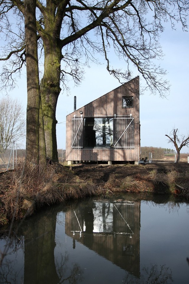 A distinctive folded roof tops this small energy-efficient house in Bohemia. It has a 624 sq ft ground floor plus two bedroom lofts. | www.facebook.com/SmallHouseBliss