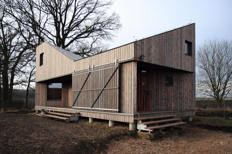 A distinctive folded roof tops this small energy-efficient house in Bohemia. It has a 624 sq ft ground floor plus two bedroom lofts. | www.facebook.com/SmallHouseBliss