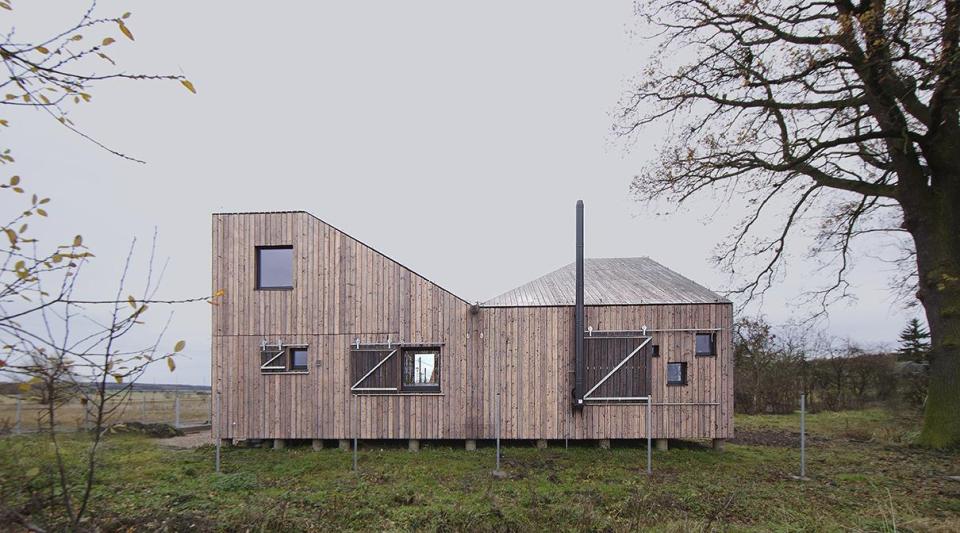 A distinctive folded roof tops this small energy-efficient house in Bohemia. It has a 624 sq ft ground floor plus two bedroom lofts. | www.facebook.com/SmallHouseBliss