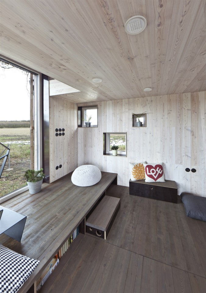 A distinctive folded roof tops this small energy-efficient house in Bohemia. It has a 624 sq ft ground floor plus two bedroom lofts. | www.facebook.com/SmallHouseBliss