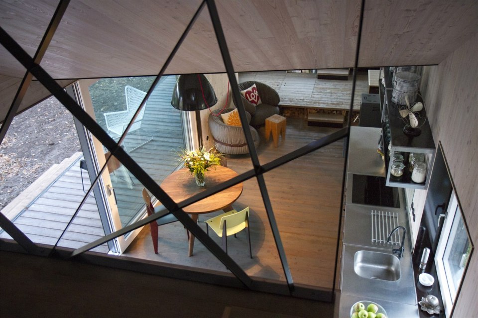 A distinctive folded roof tops this small energy-efficient house in Bohemia. It has a 624 sq ft ground floor plus two bedroom lofts. | www.facebook.com/SmallHouseBliss